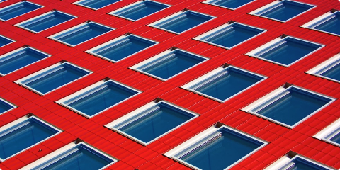 Set of glass windows in a red building.